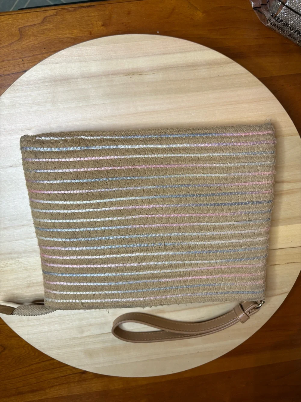 corded wristlet clutch purse featuring a multicolor thin stripe design.